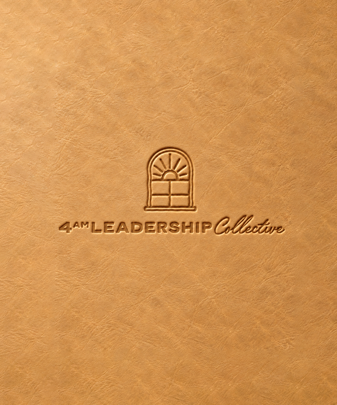 The complete 4AM primary logo embossed into warm clay-colored leather